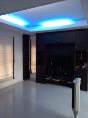 Modern living room with ambient lighting and entertainment unit