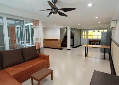 Spacious modern living room with dining area and elegant furnishings