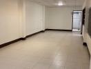 Spacious and brightly lit empty hallway inside a building