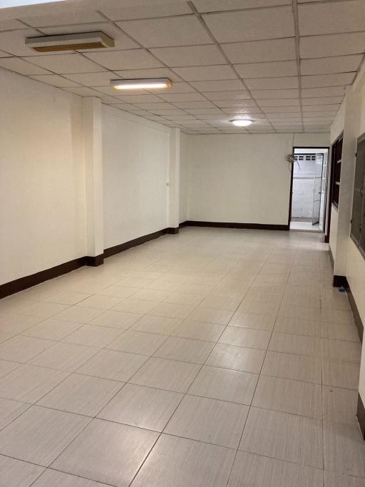 Spacious and brightly lit empty hallway inside a building