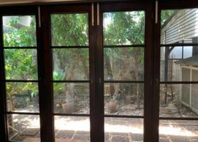 View of a shady patio through glass doors
