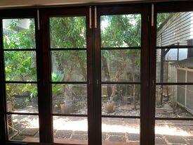 View of a shady patio through glass doors