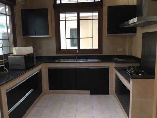 Spacious kitchen with modern appliances and ample storage