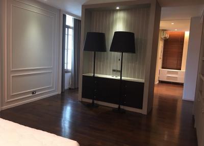Modern bedroom with elegant design and hardwood floors