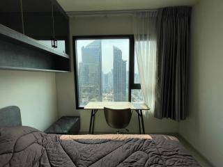 Modern bedroom with a city view