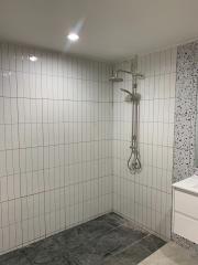 Modern bathroom with tile finish and shower