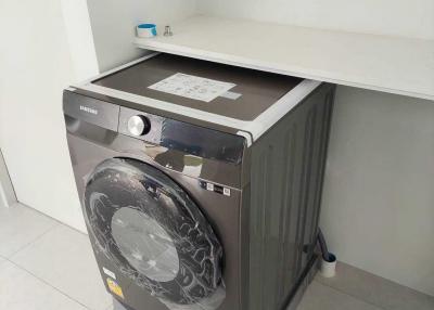 Samsung washing machine in a modern laundry area