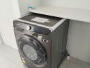 Samsung washing machine in a modern laundry area