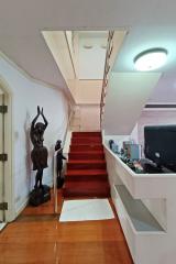 Interior staircase with artistic sculptures