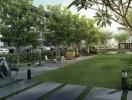 Modern residential building exterior with landscaped front yard