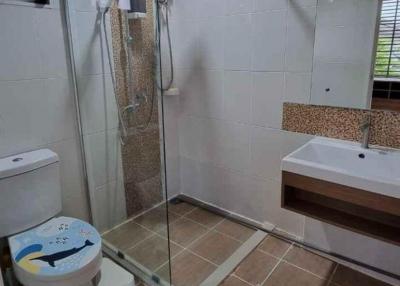 Modern bathroom with shower, toilet and sink