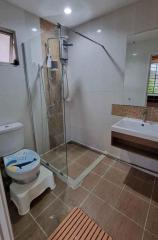 Modern bathroom with shower, toilet and sink