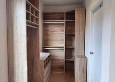 Cozy bedroom with wooden wardrobe and parquet flooring