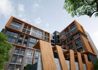 Modern residential apartment building with wood and glass exterior
