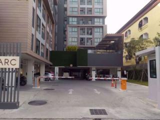 Modern residential building entrance with parking access