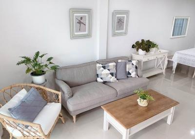 Bright and tidy living room with modern furniture and decorative plants