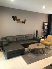 Modern living room interior with leather sofa and contemporary decor