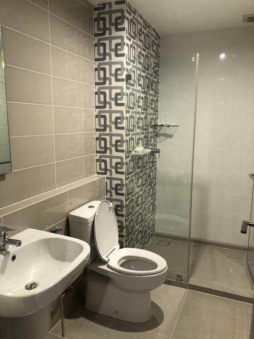 Modern bathroom with patterned wall tiles