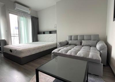 Modern furnished bedroom with natural light