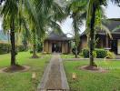 Tropical home exterior with lush greenery