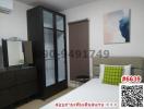 Modern bedroom interior with wardrobe and art decor