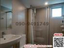 Modern bathroom with glass shower and basin