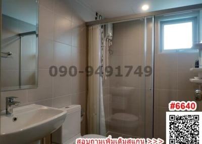 Modern bathroom interior with glass shower enclosure