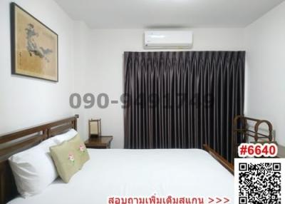 Cozy bedroom with a double bed and air condition unit