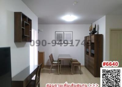 Spacious furnished living room with dining area and wooden furniture
