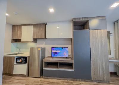 Modern kitchen with stainless steel appliances and wooden cabinetry