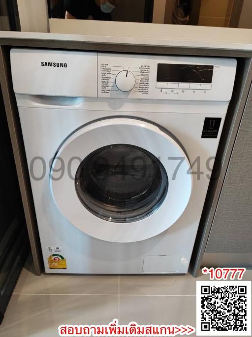 Front-load Samsung washing machine installed in a home laundry area