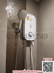 Modern electric shower unit in a tiled bathroom