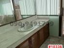 Spacious bathroom with large vanity and abundant natural light
