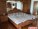 Elegant bedroom with wooden furniture and hardwood floors