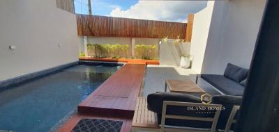 Spacious outdoor area with swimming pool and wooden deck