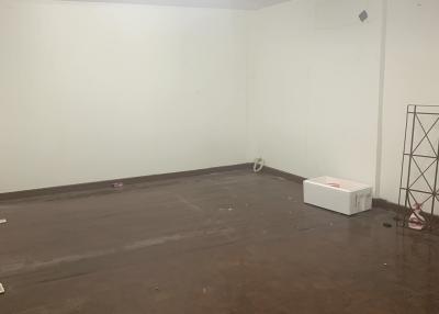 Empty room with wooden flooring and white walls