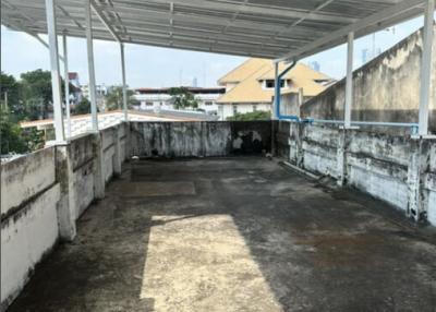 Spacious rooftop area of a building with potential for development