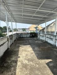 Spacious rooftop area of a building with potential for development