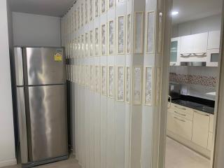 Modern kitchen interior with stainless steel refrigerator