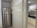 Modern kitchen interior with stainless steel refrigerator