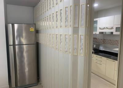 Modern kitchen interior with stainless steel refrigerator