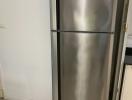 Stainless steel refrigerator in modern kitchen setting