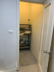 Compact storage closet with shelving units