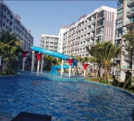 Modern residential complex with large swimming pool and water slide