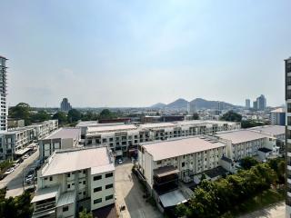 Expansive view from a high-rise apartment balcony showcasing the cityscape