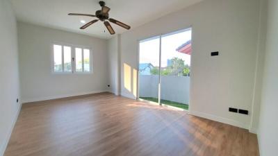 Bright and spacious empty bedroom with large windows