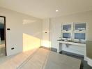 Modern kitchen with white cabinetry and natural light