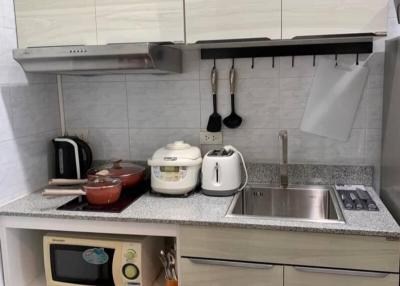 Modern kitchen with stainless steel appliances and white cabinetry