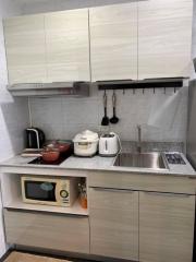 Modern kitchen with stainless steel appliances and white cabinetry