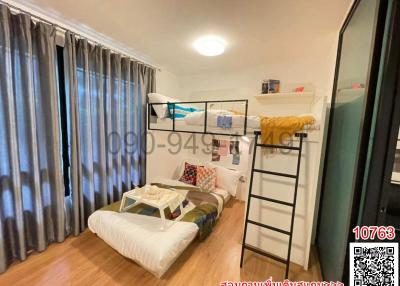 Cozy bedroom with bunk bed and ample lighting